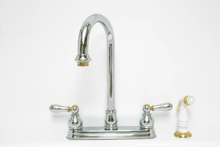 A curved chrome faucet with hot and cold taps