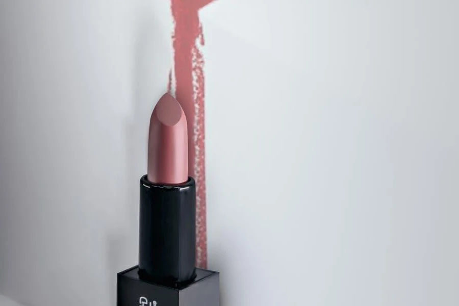 A lipstick with marks on a white wall