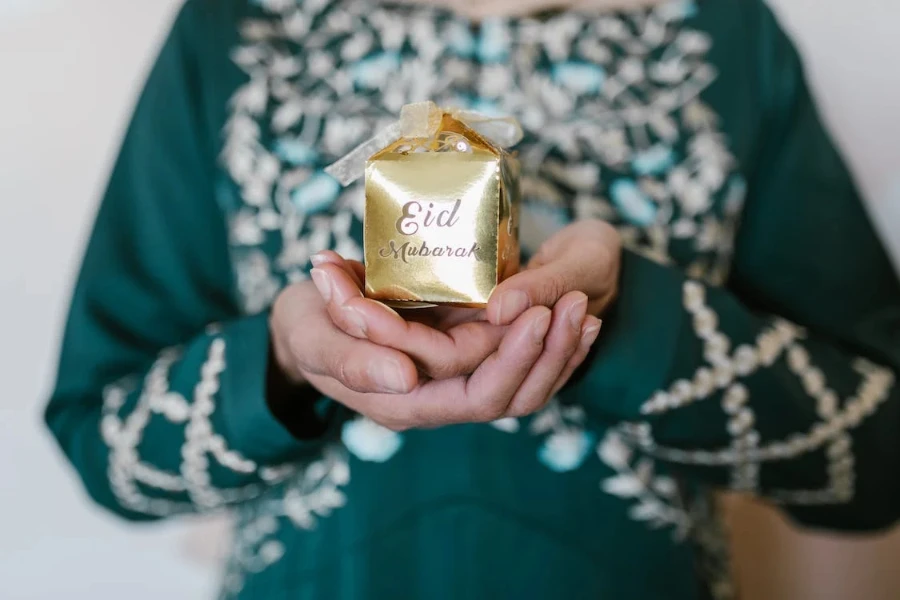 A person holding a parcel during Eid celebrations