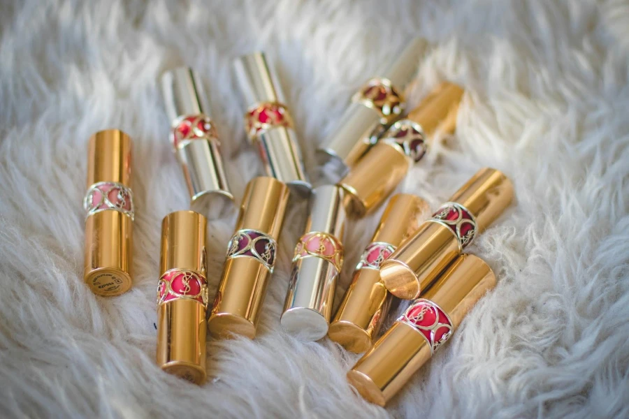 A set of lipsticks arranged on a fur-like carpet