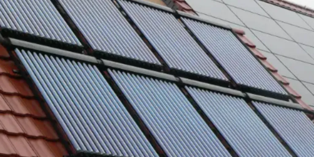 an array of evacuated tube solar collectors on a roof
