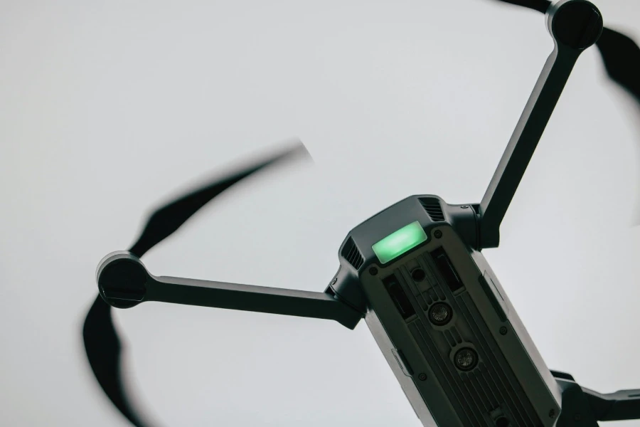 Close up of a black drone with propellers moving