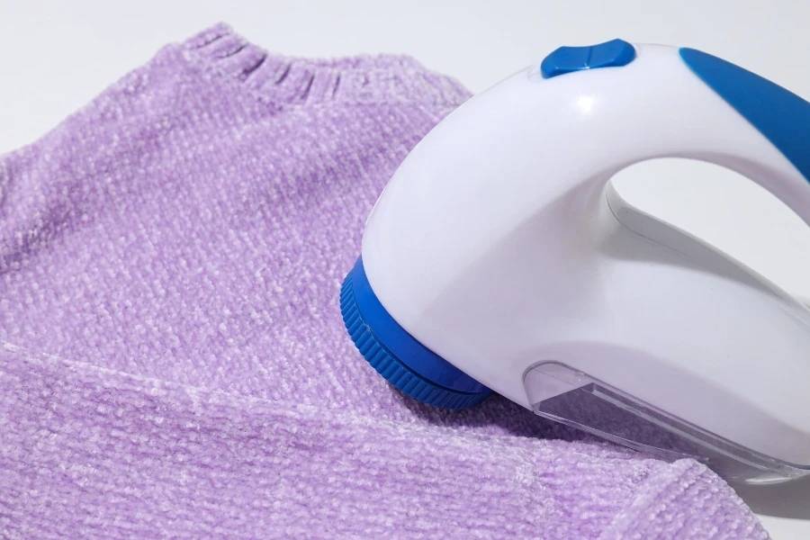 electric lint remover on a purple sweater