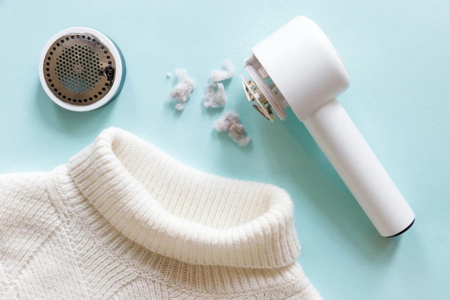 fabric shaver and a white sweater