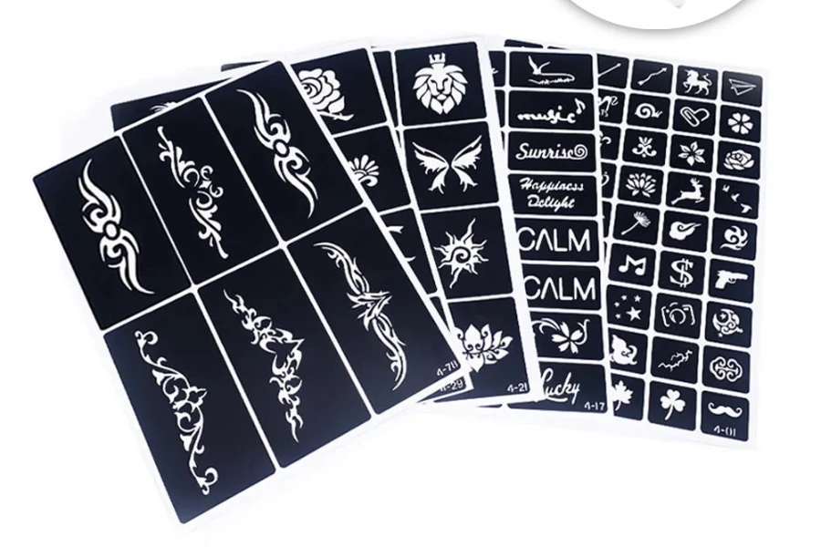 Four different tattoo stencils on a white background