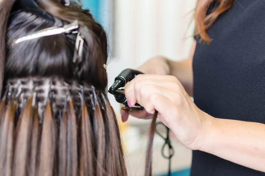 hairdresser works in the salon and upgrades the hair to the customer