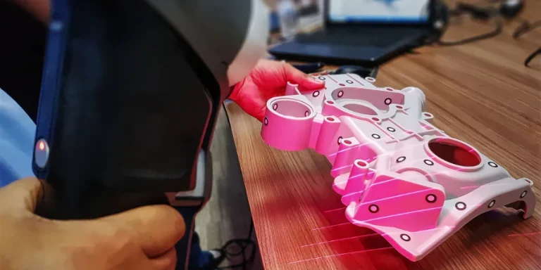 Man Using Portable Scanner to Scan 3D CAD Model