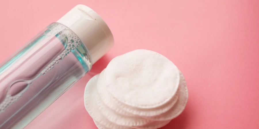 cotton pads, bottle with toner