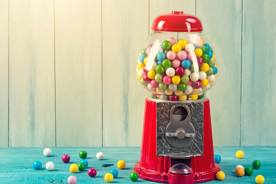 Carousel Gumball Machine Bank on a wooden background
