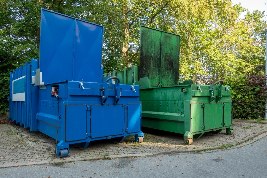 two garbage compactors
