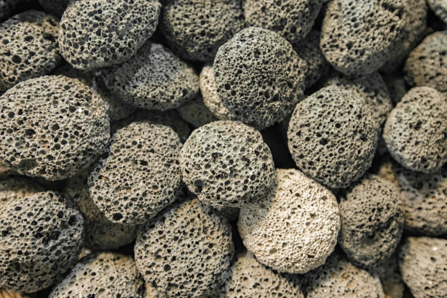 Pumice stone foot shaped scrub tool close up
