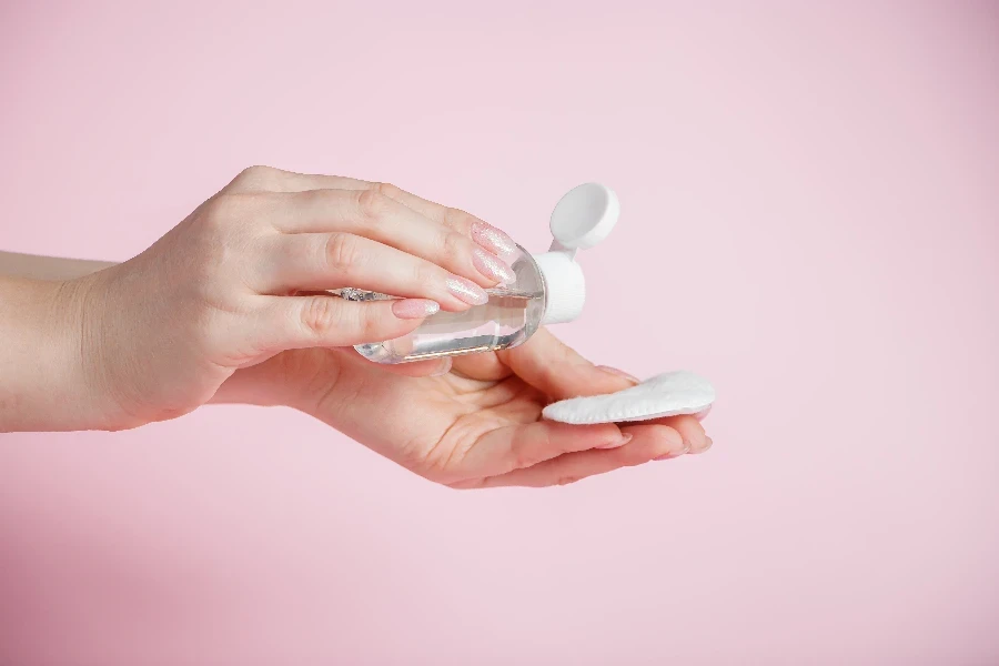 Hands of a young woman with antibacterial liquid
