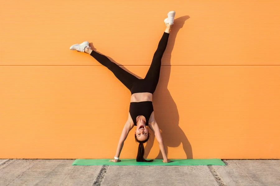 Overjoyed excited girl with perfect athletic body