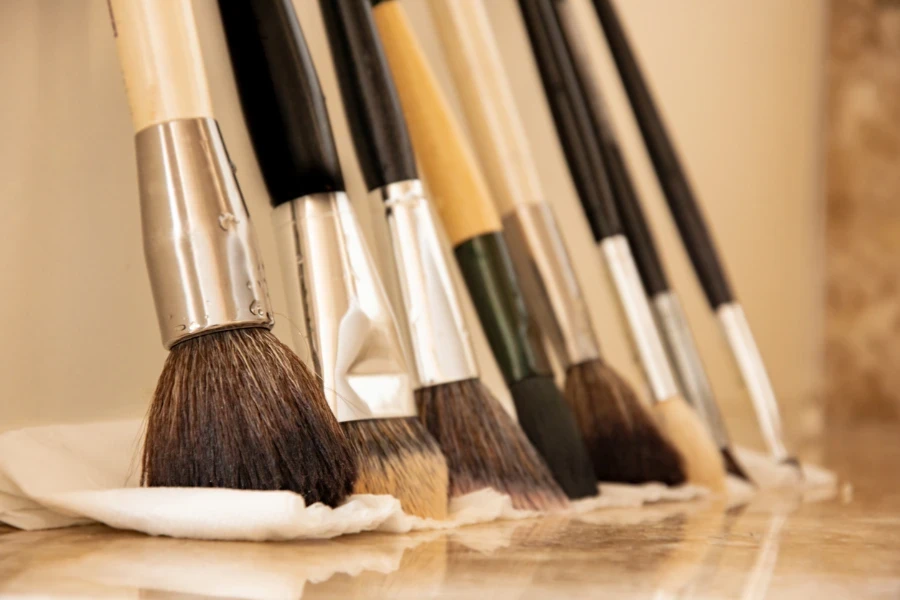 cleaning makeup brushes on bathroom sink
