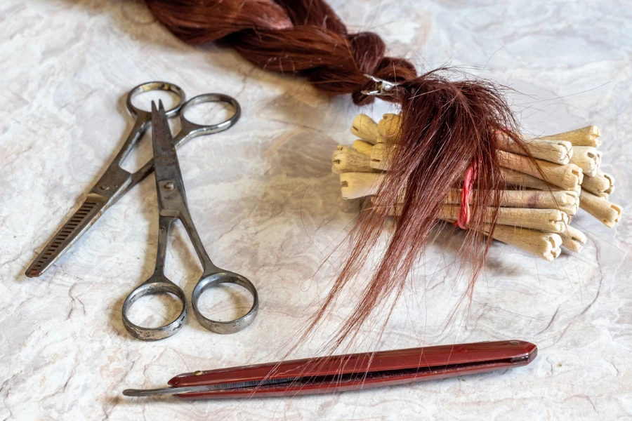 Background Antique hairdressing tool with hair braid
