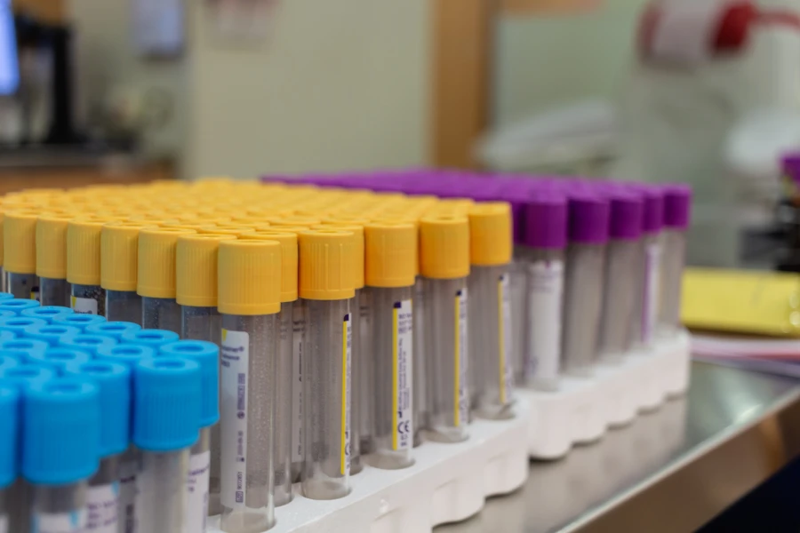 Counter of test tubes with different colored caps
