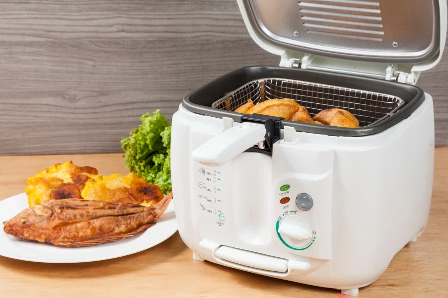 A white automatic electric fryer pot
