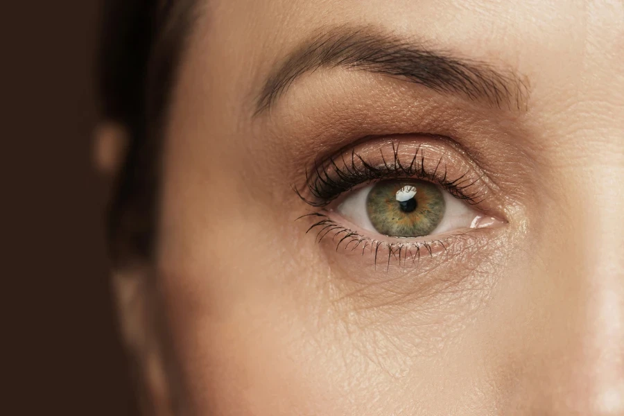 Close-up of aged female eye with wrinkled skin
