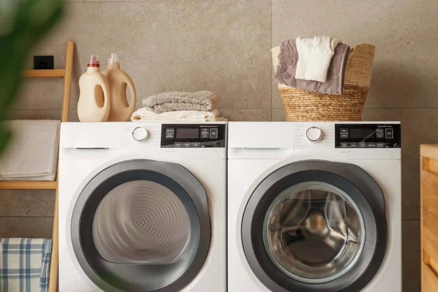 Interior of a real laundry room with a washing machine at home
