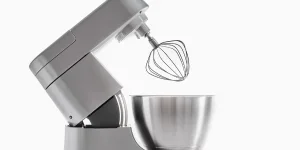 Silver food processor with whisk on white background isolated