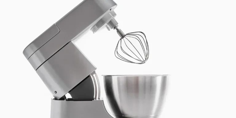 Silver food processor with whisk on white background isolated
