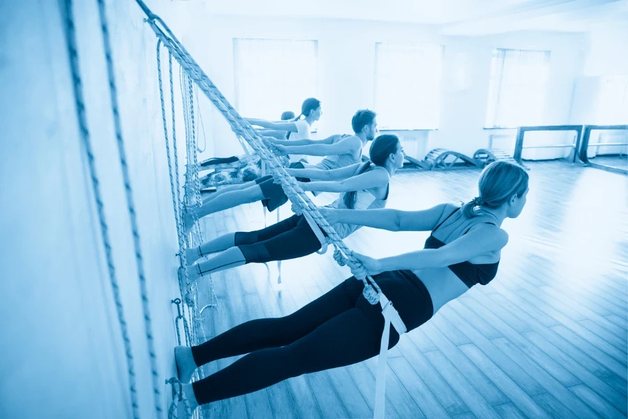 women hanging on ropes