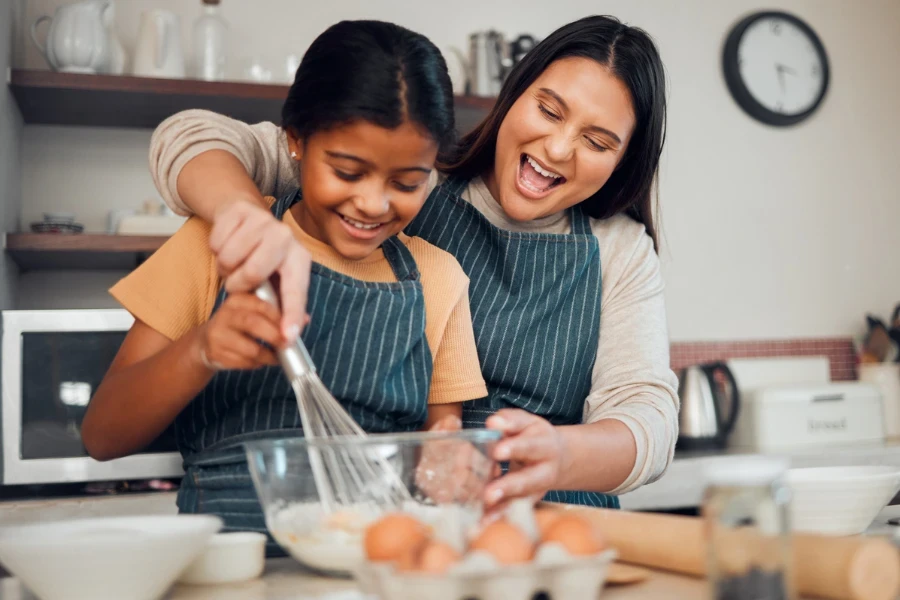 Mother and daughter cooking
