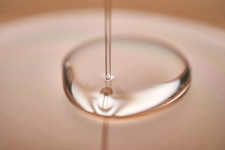 A juicy drop of gel on a beige background

