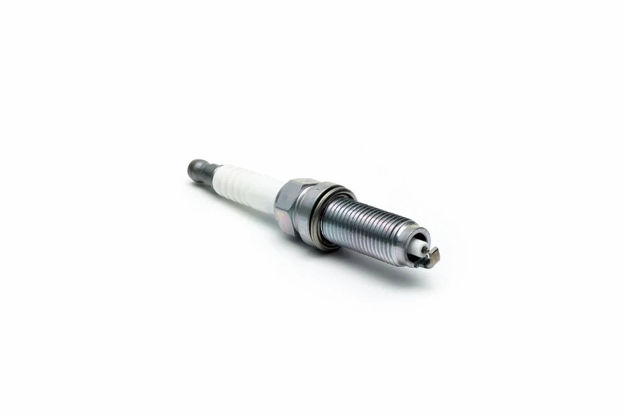 New spark plug on white background