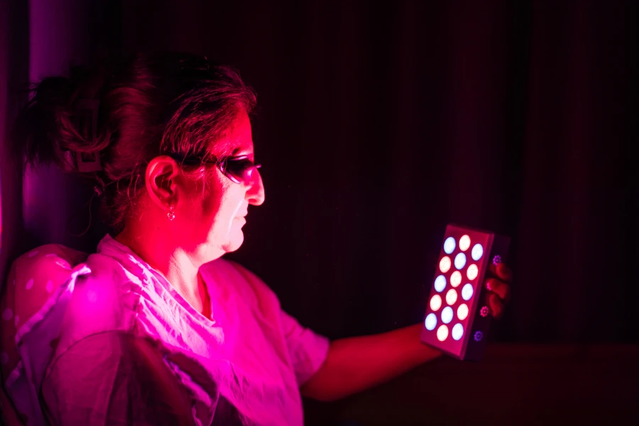 Closeup of senior woman doing the red light therapy
