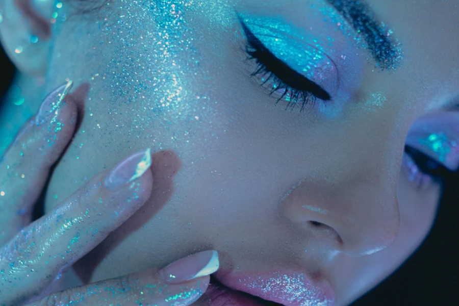 Woman cosmic themed glitter beauty makeup
