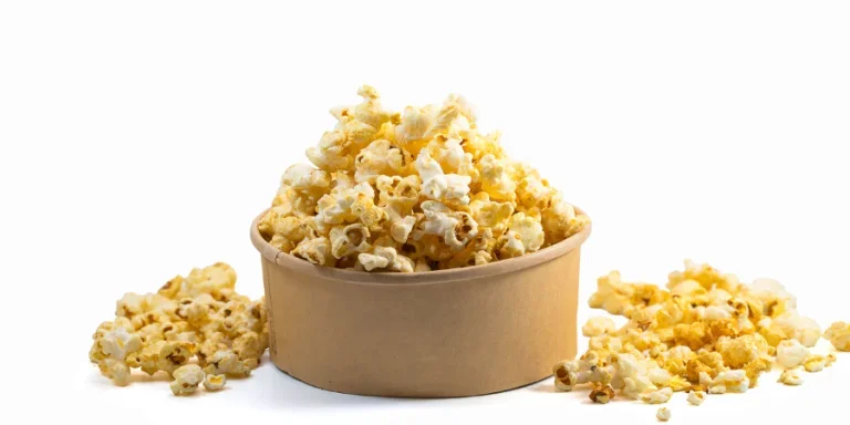 Popcorn in disposable bucket isolated on white background
