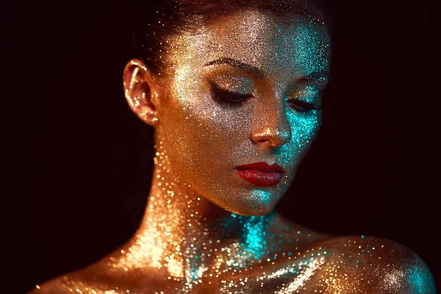 Portrait of Beautiful Woman with Sparkles on her Face
