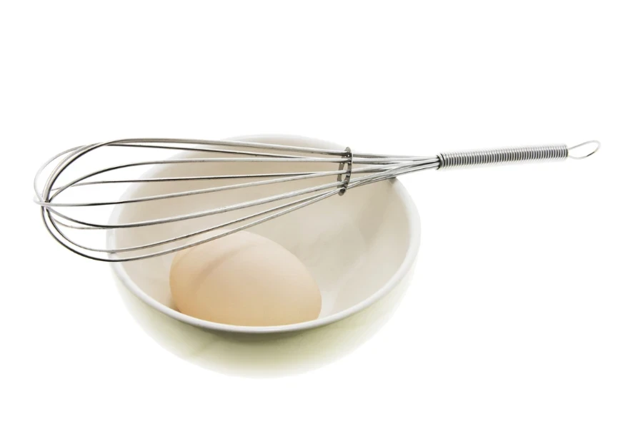 White Egg on Bowl with Whisk
