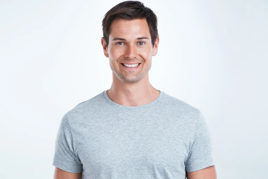 Studio portrait of a casually dressed young man against a white background