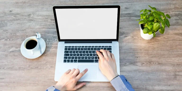 Person's Hand on Laptop