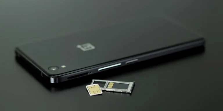 Black Smartphone on Black Table Top