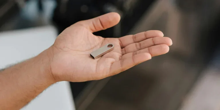 modern portable memory device on palm of hand