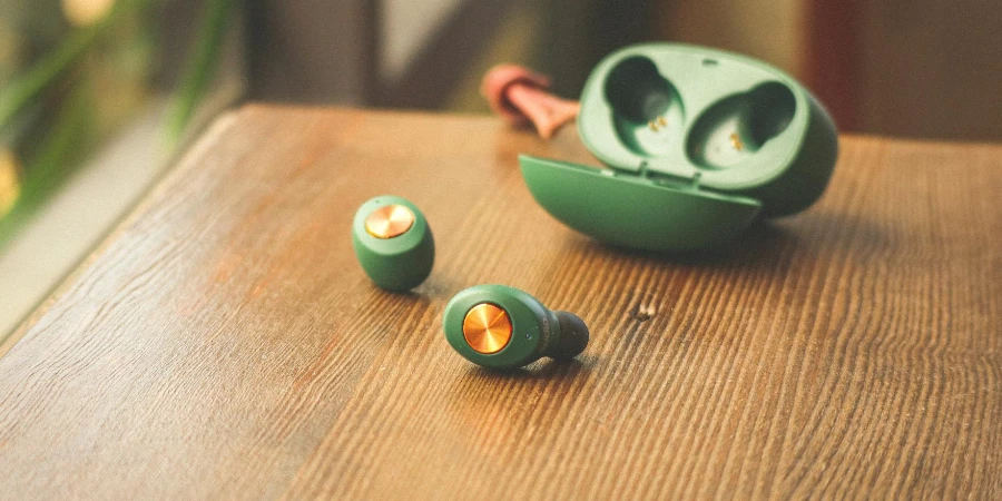 Green Earphones on Wooden Table