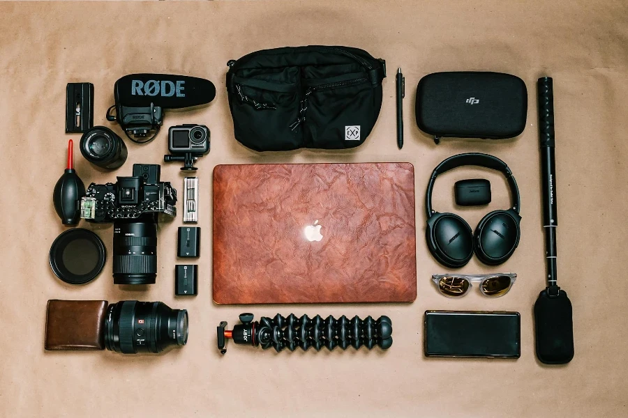 Overhead view of laptop and photo camera