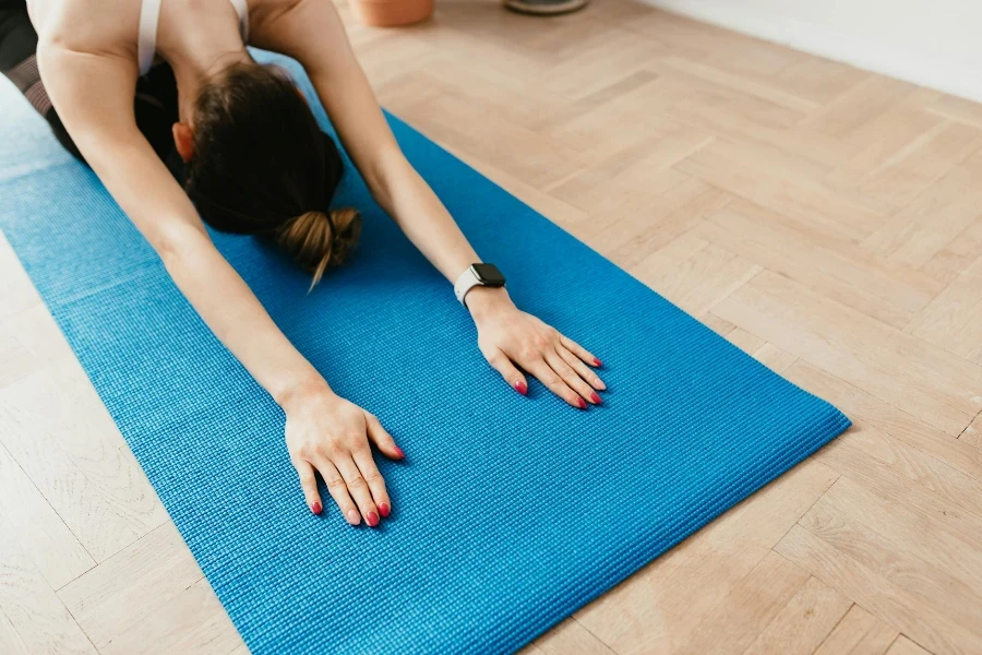 sporty female performing Child Pose