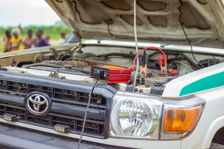 Battery Charger under Opened Car Hood