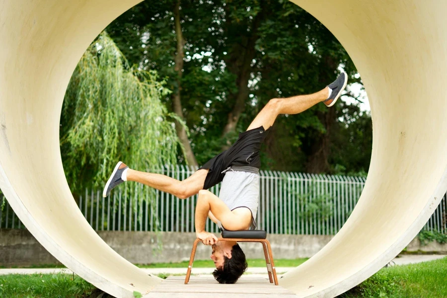 Photo of a Man in Black Shorts Exercising