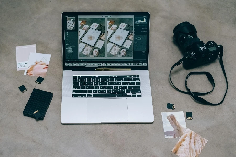 A Laptop Near the Black Dslr Camera