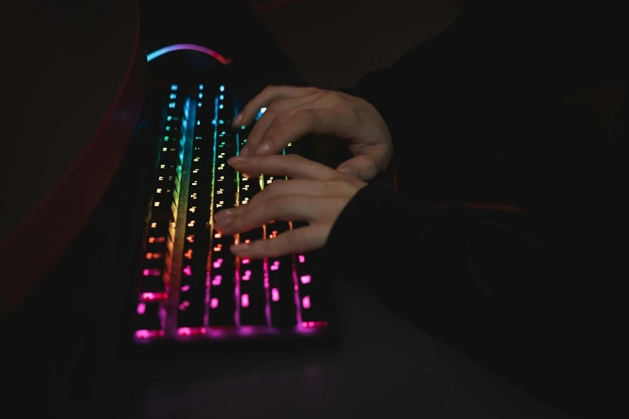 Close-Up View of a Person Typing on Keyboards