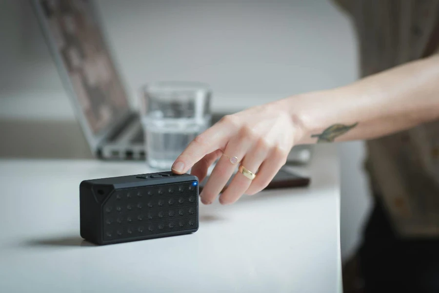 Rectangular Black Speaker on White Wooden Surface