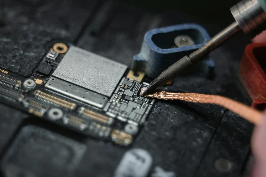 A Wire Being Soldered on the Motherboard