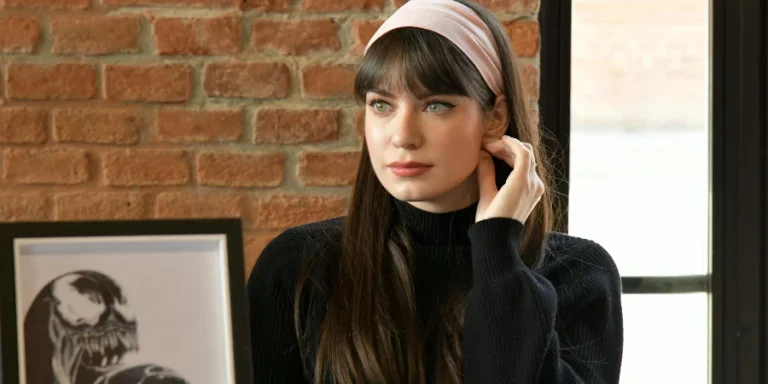 Woman in Black Sweater Sitting on Chair