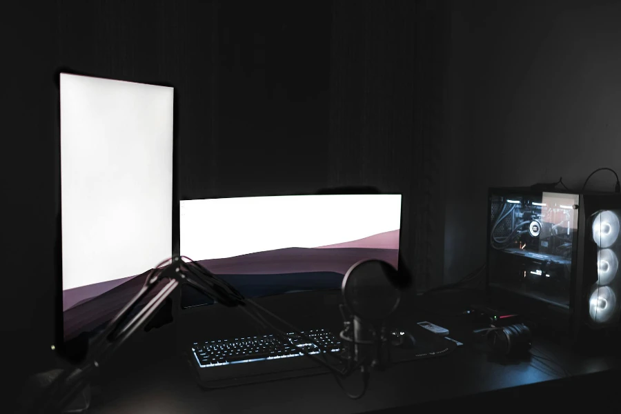 Gaming setup with glowing modern monitors