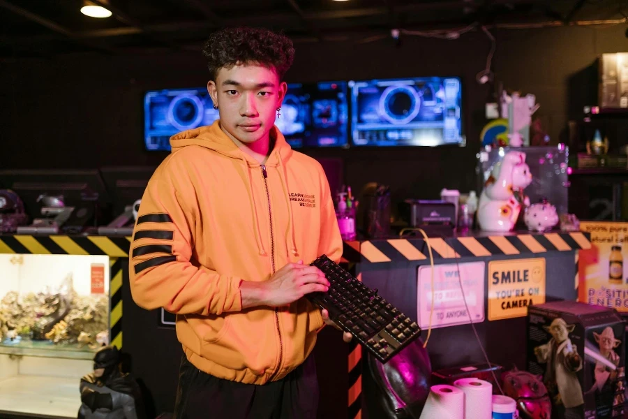 Man Holding a Mechanical Keyboard